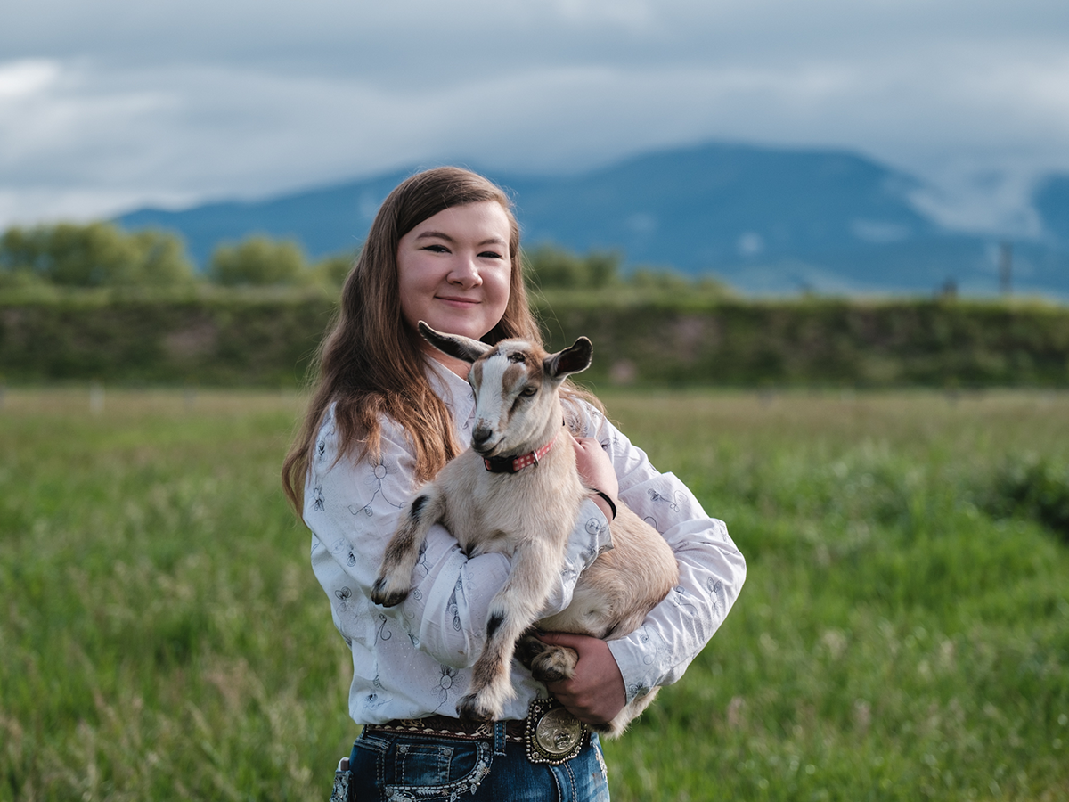 4-H member holding a dairy goat