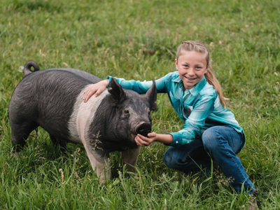 4-H member with a pig