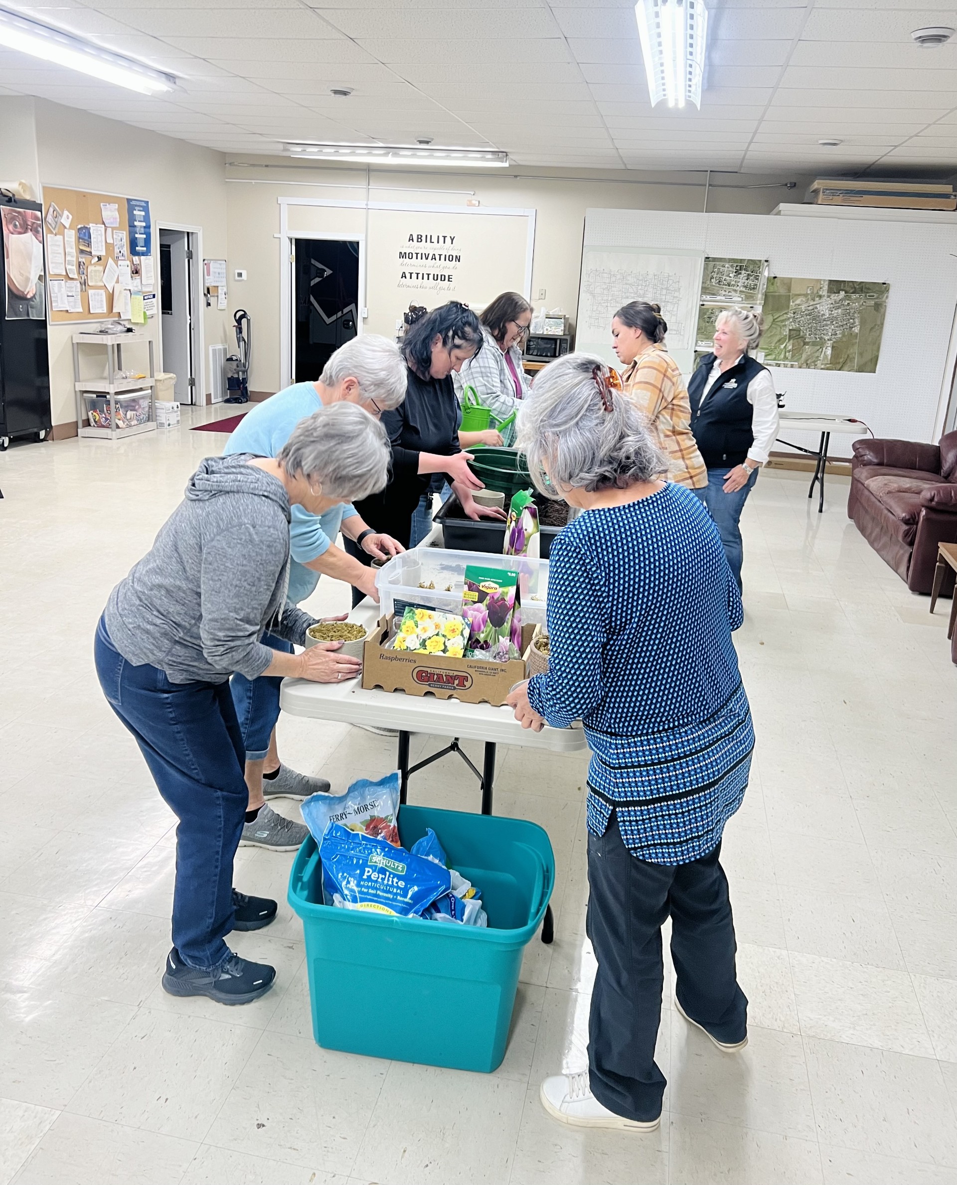 Class participants learning about soil blocking and seed starting.