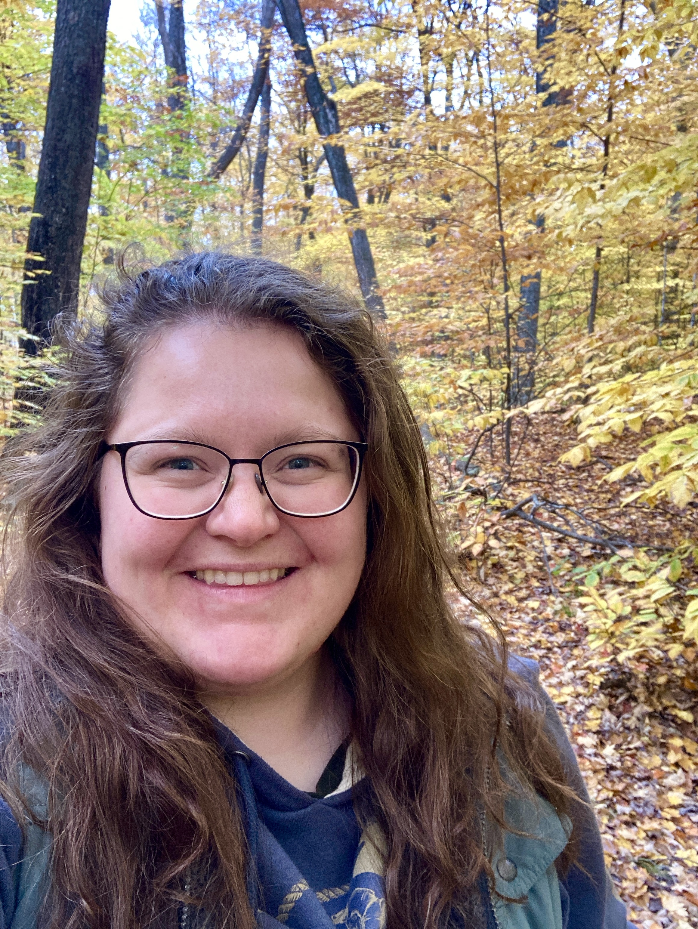haley headshot picture of Haley surrounded by fall foliage